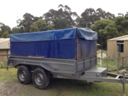 10 by 5 tilt trailer with high  sides and full strap down tarp